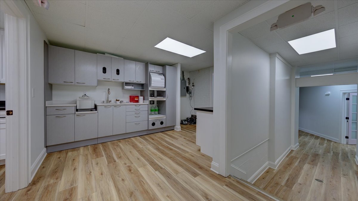 A dental lab area with grey cabinets.