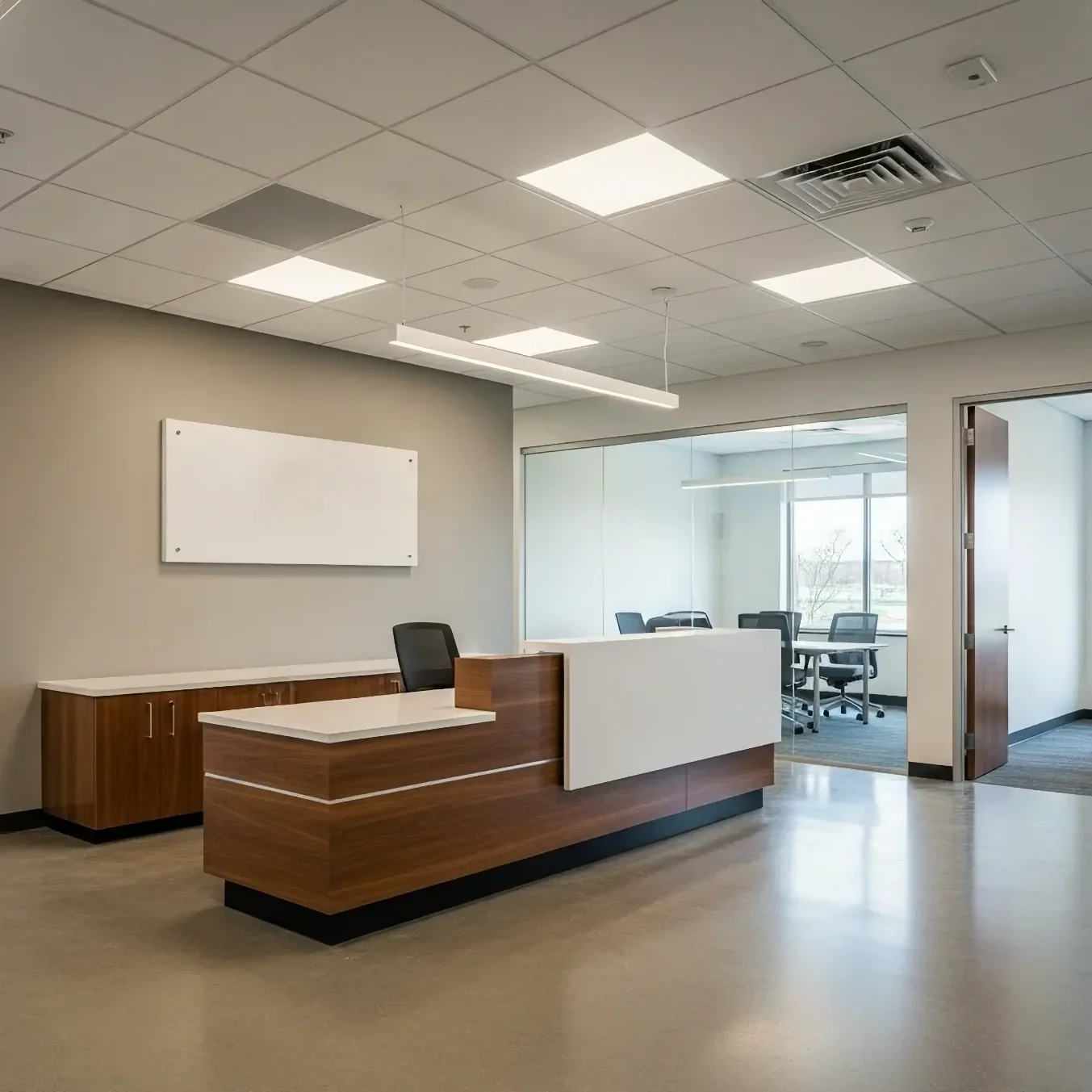 office reception area with a wooden desk and rooms off to the side
